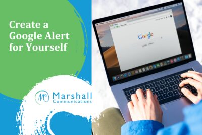 Google Alerts for personal branding - person typing on laptop with Google open