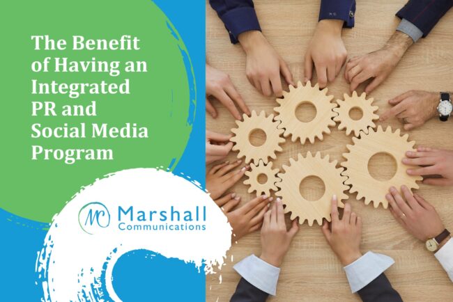 The Benefit of Having an Integrated PR and Social Media Program: Hands holding wooden gears on a table.