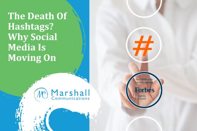 Person pointing at a hashtag symbol
