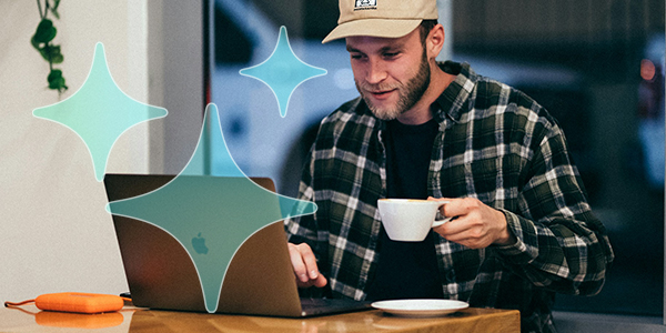 A photo of someone at a coffeeshop on their laptop with AI "stars" overlaid